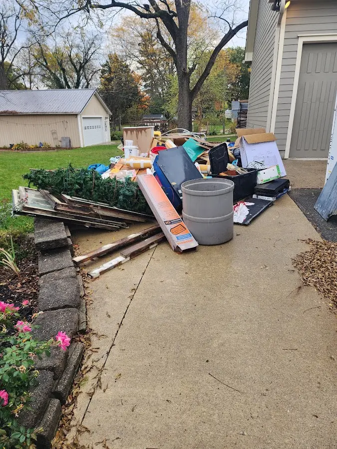 Dumpster being loaded with debris for Estate Cleanout Dumpster Rental in Marlow Heights